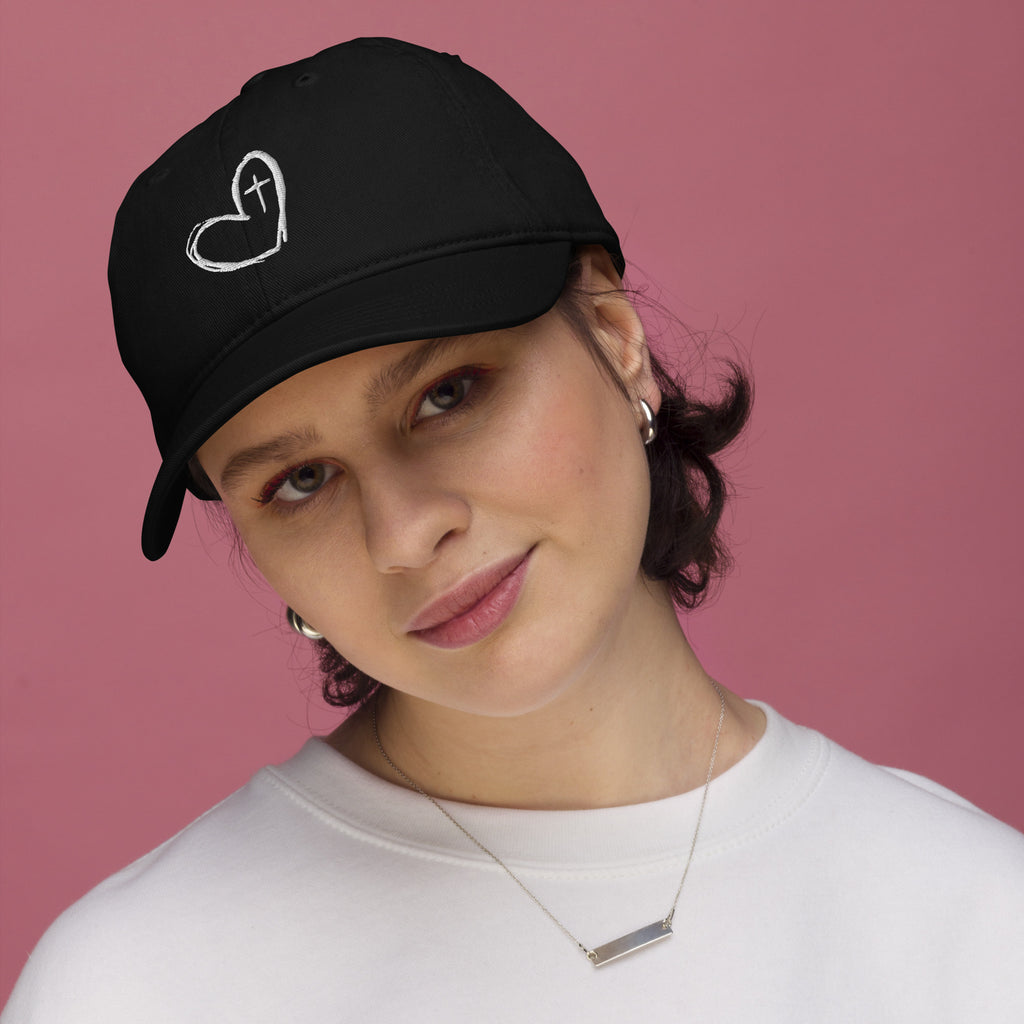 Woman wearing Fear Not organic cotton embroidered Christian hat in black lifestyle photo