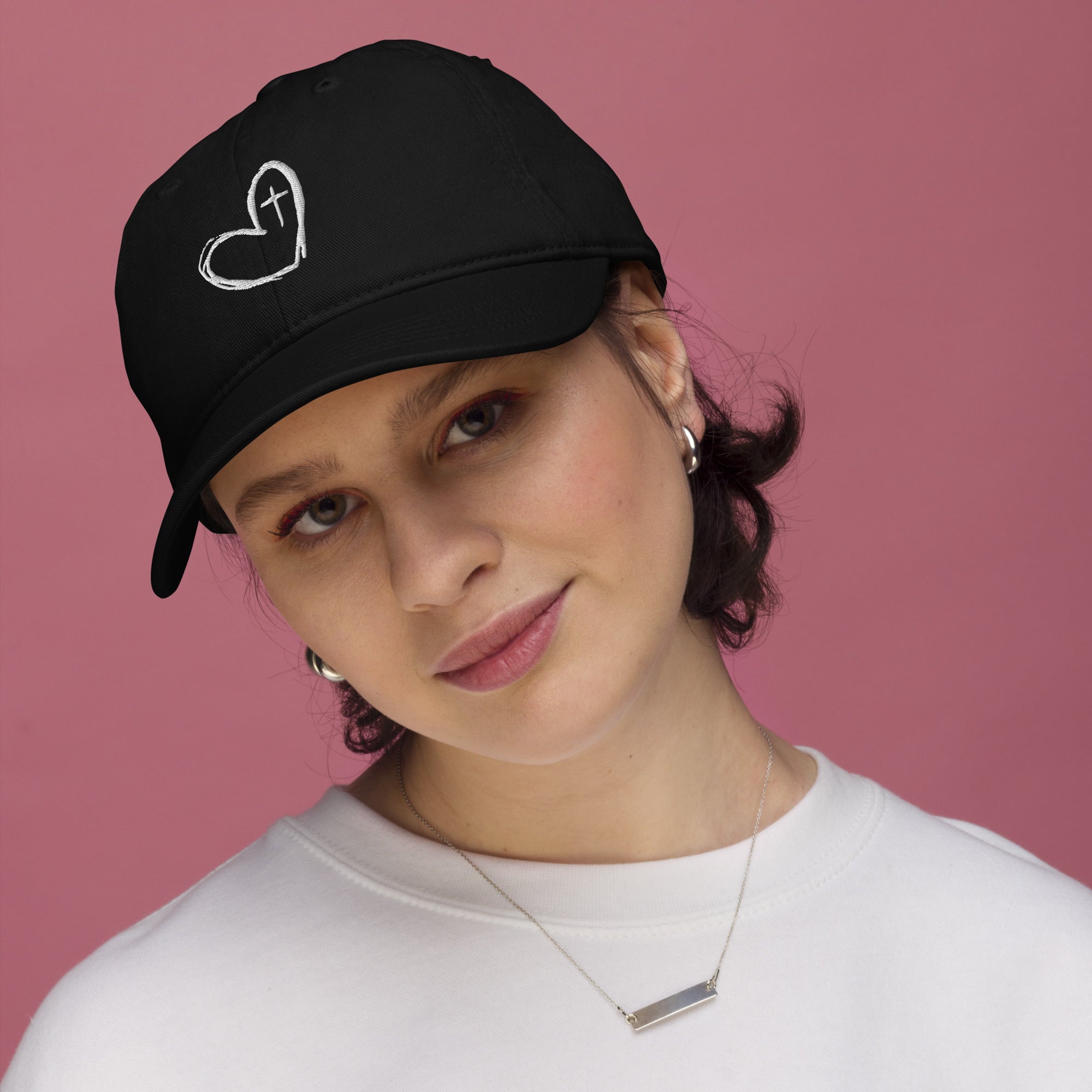 Woman wearing Fear Not organic cotton embroidered Christian hat in black lifestyle photo
