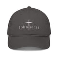 John 16:33 unisex organic cotton embroidered hat in black - front view